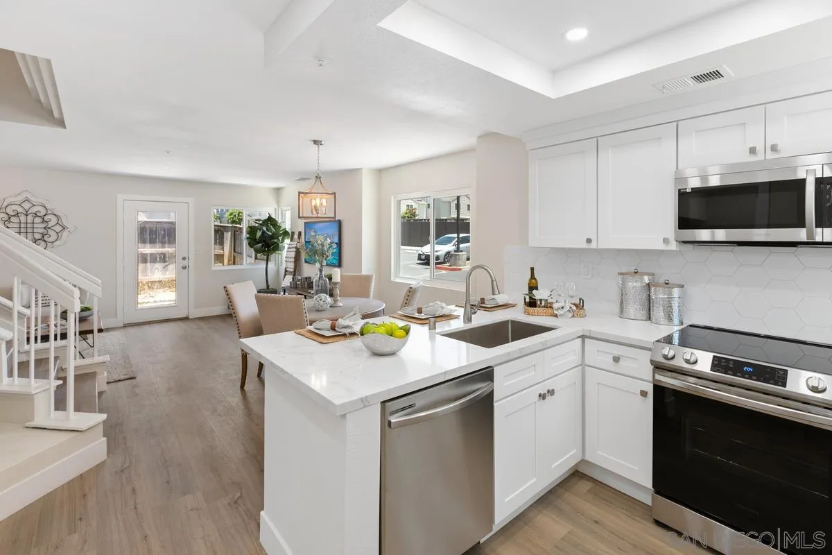 2301 Kings View Circle Spring Valley, CA 91977 - Photo 12 of 26 a kitchen with a sink stove top oven and microwave