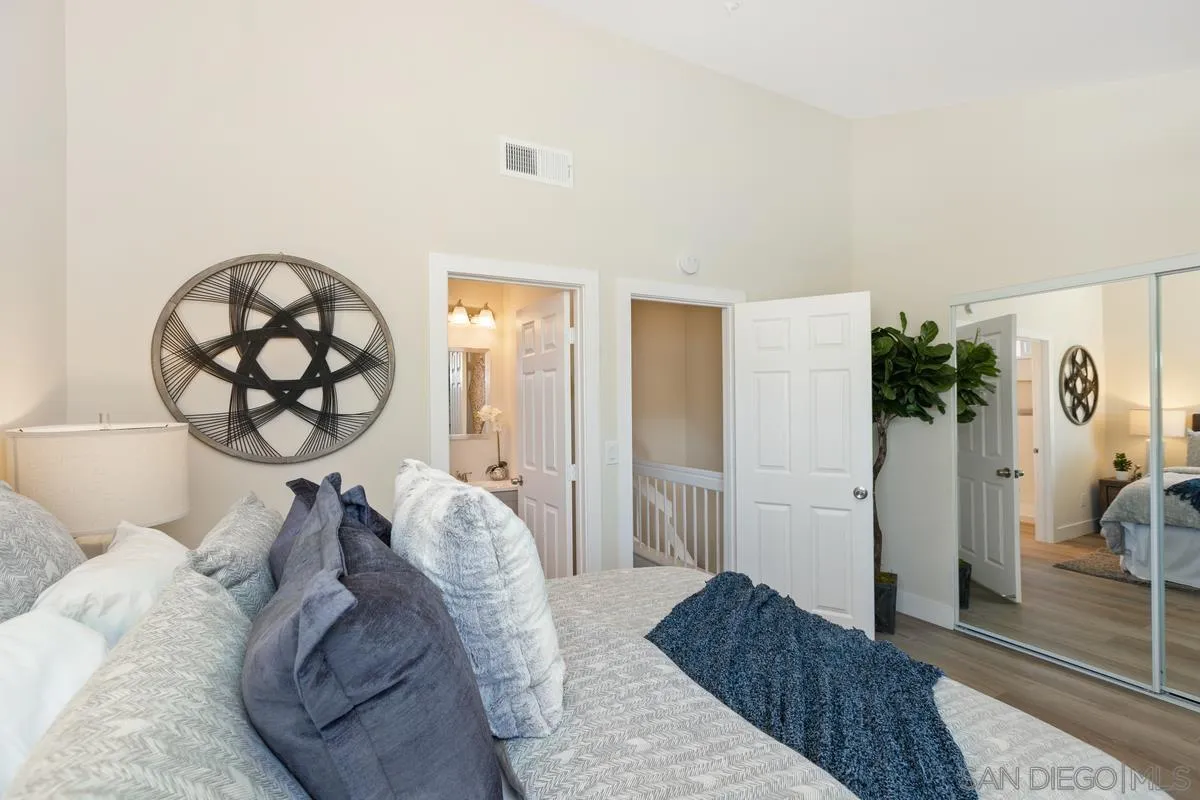 2301 Kings View Circle Spring Valley, CA 91977 - Photo 18 of 26 a bedroom with a large bed and a rug