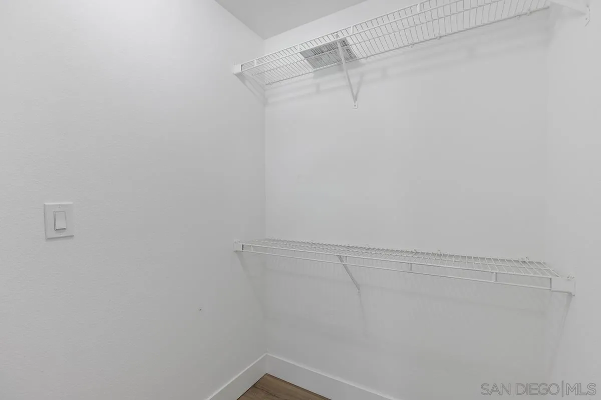 2301 Kings View Circle Spring Valley, CA 91977 - Photo 23 of 26 a view of a room with racks on the wall