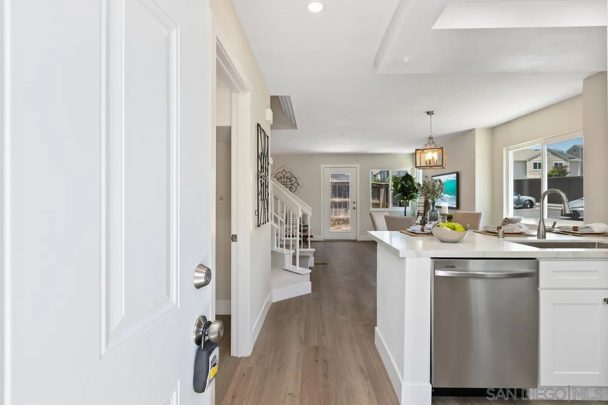 2301 Kings View Circle Spring Valley, CA 91977 - Photo 3 of 26 a kitchen with counter top space and living room view