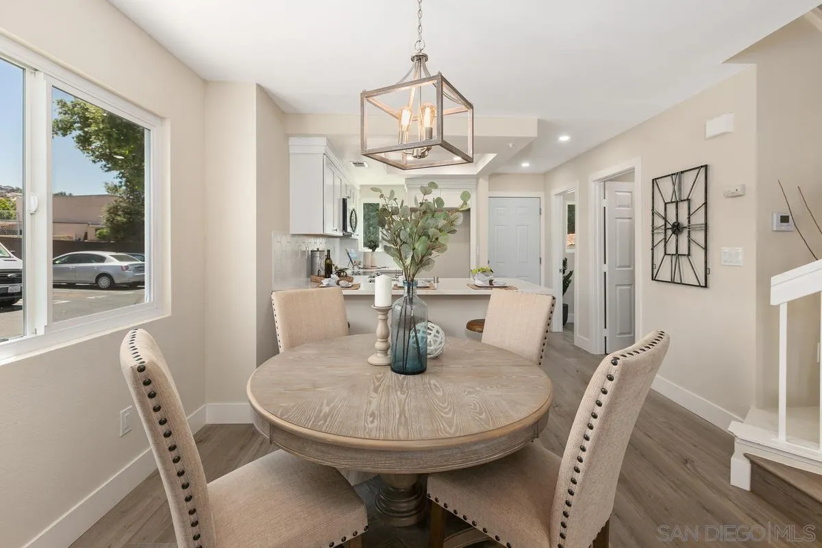 2301 Kings View Circle Spring Valley, CA 91977 - Photo 9 of 26 a dining room with furniture a chandelier and wooden floor