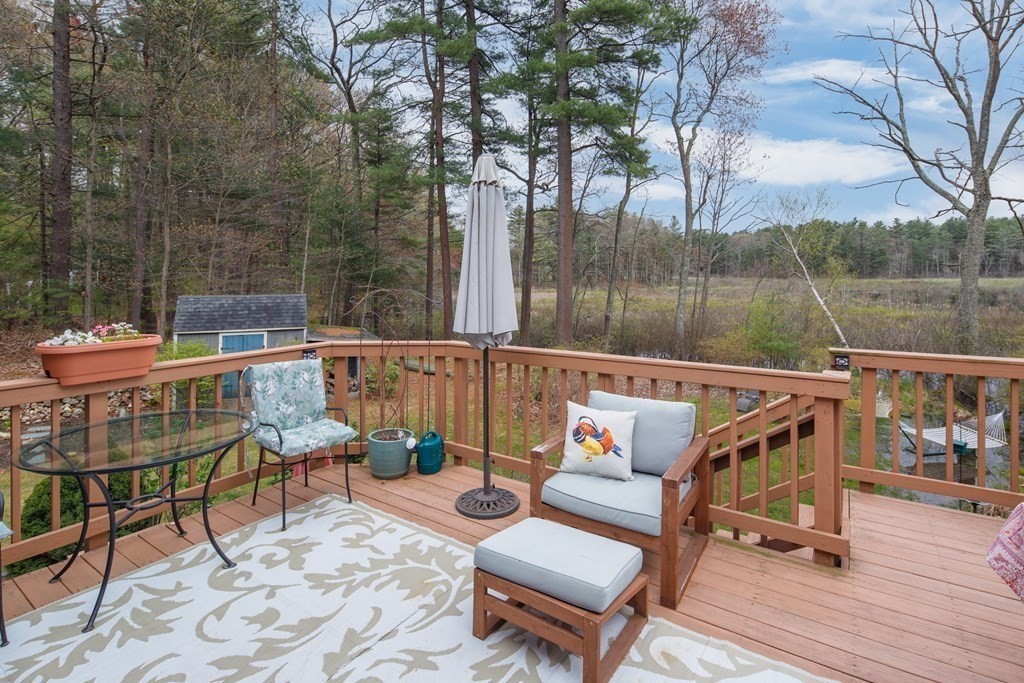 170 Haverhill Road Topsfield, MA 01983 - Photo 4 of 31 a balcony with wooden floor and outdoor seating
