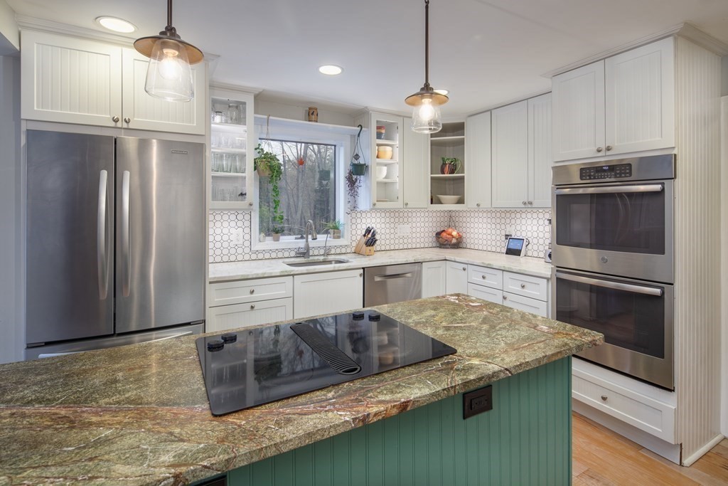 170 Haverhill Road Topsfield, MA 01983 - Photo 8 of 31 a kitchen with stainless steel appliances granite countertop a sink refrigerator and cabinets