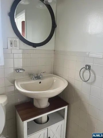 a bathroom with a sink and mirror