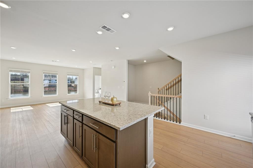 216 Wilder Ridge Way Lawrenceville, GA 30044 - Photo 11 of 46 a view of a kitchen from the hallway