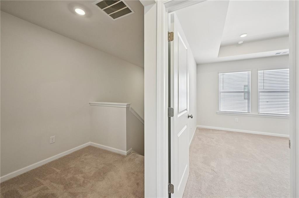 216 Wilder Ridge Way Lawrenceville, GA 30044 - Photo 21 of 46 an empty room with windows