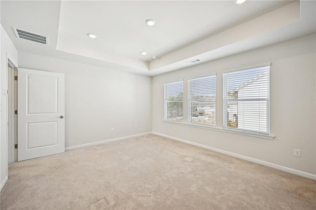 216 Wilder Ridge Way Lawrenceville, GA 30044 - Photo 23 of 46 a big room with windows and closet