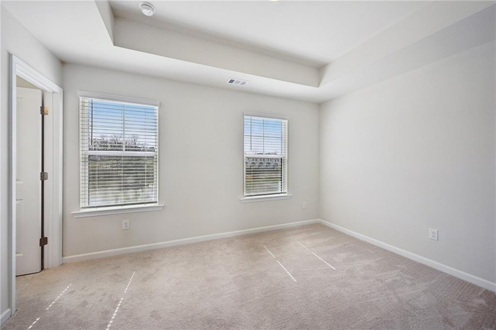 216 Wilder Ridge Way Lawrenceville, GA 30044 - Photo 29 of 46 an empty room with a window