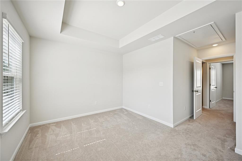 216 Wilder Ridge Way Lawrenceville, GA 30044 - Photo 30 of 46 an empty room with windows and closet