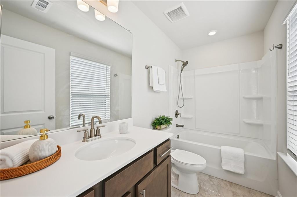 216 Wilder Ridge Way Lawrenceville, GA 30044 - Photo 31 of 46 a bathroom with a sink toilet and shower