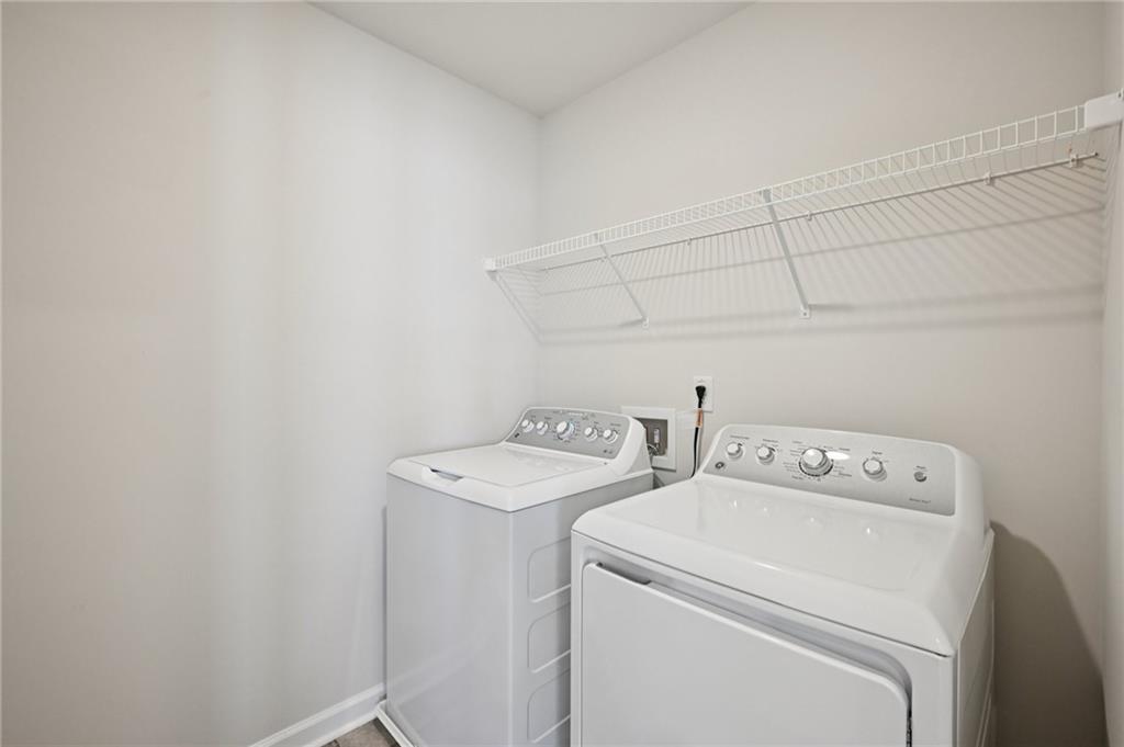 216 Wilder Ridge Way Lawrenceville, GA 30044 - Photo 34 of 46 a utility room with dryer and washer