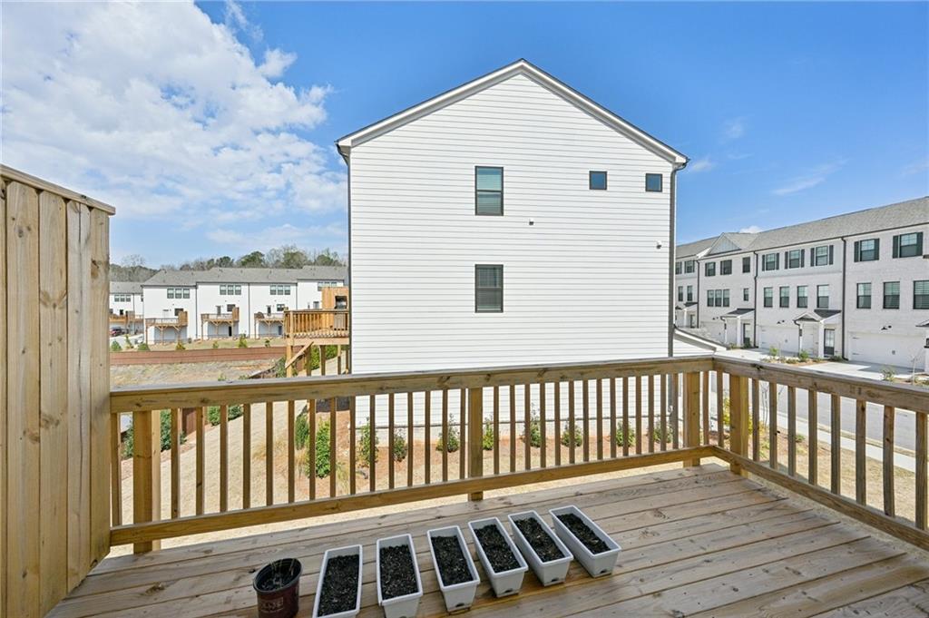 216 Wilder Ridge Way Lawrenceville, GA 30044 - Photo 35 of 46 a view of a two chairs and table in the balcony