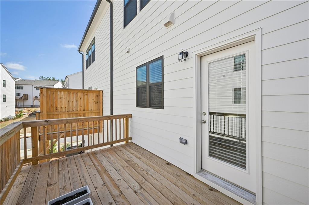 216 Wilder Ridge Way Lawrenceville, GA 30044 - Photo 36 of 46 a view of balcony with wooden floor and deck