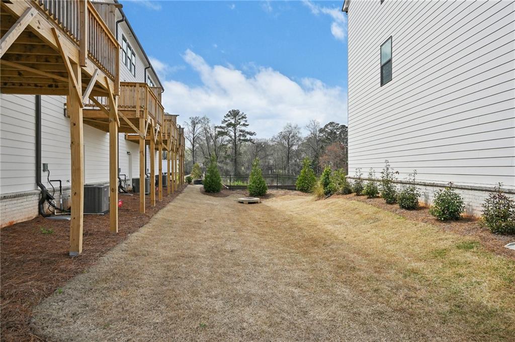 216 Wilder Ridge Way Lawrenceville, GA 30044 - Photo 38 of 46 a view of a house with a backyard
