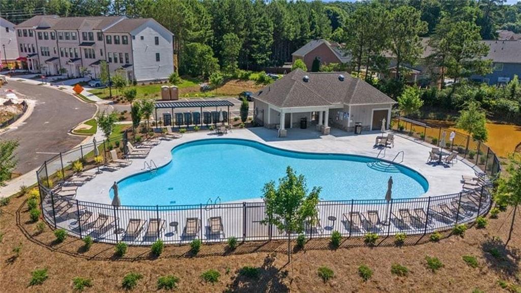 216 Wilder Ridge Way Lawrenceville, GA 30044 - Photo 40 of 46 a view of a house with a swimming pool