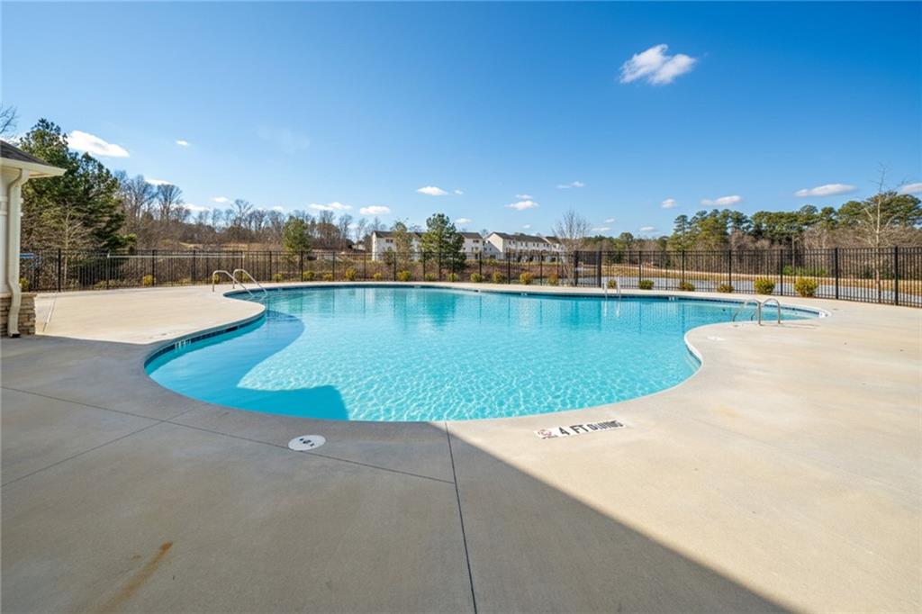 216 Wilder Ridge Way Lawrenceville, GA 30044 - Photo 41 of 46 a view of a swimming pool and an outdoor space