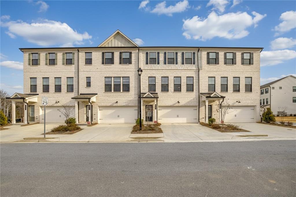 216 Wilder Ridge Way Lawrenceville, GA 30044 - Photo 42 of 46 a front view of a building with street view