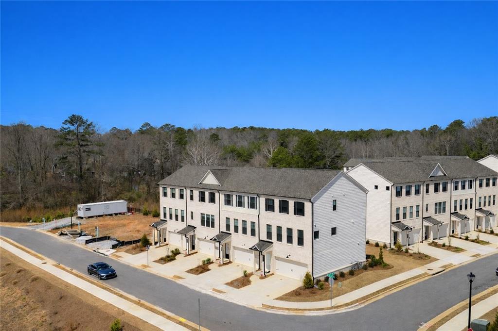 216 Wilder Ridge Way Lawrenceville, GA 30044 - Photo 43 of 46 a view of a house with a swimming pool and mountain view