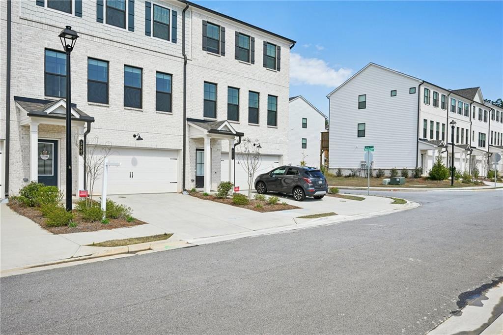 216 Wilder Ridge Way Lawrenceville, GA 30044 - Photo 45 of 46 a front view of a building with a street