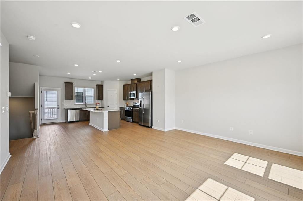 216 Wilder Ridge Way Lawrenceville, GA 30044 - Photo 6 of 46 a view of kitchen with wooden floor