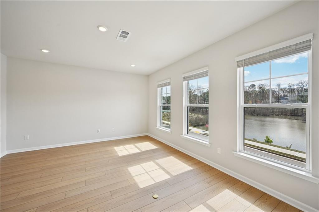 216 Wilder Ridge Way Lawrenceville, GA 30044 - Photo 7 of 46 a view of an empty room with a window