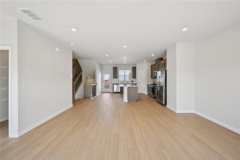 216 Wilder Ridge Way Lawrenceville, GA 30044 - Photo 8 of 46 a view of a kitchen with a sink and a refrigerator
