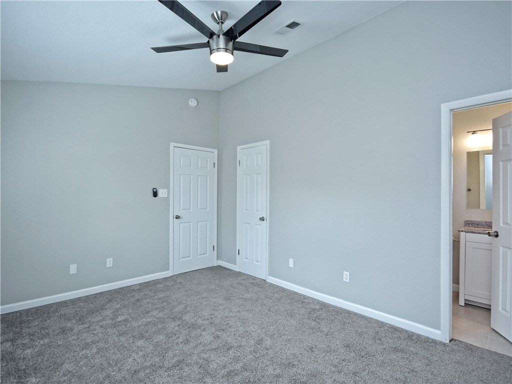 2302 Fuzz Fairway, Unit B Austin, TX 78728 - Photo 15 of 27 Primary Bedroom looking into Primary Bath.