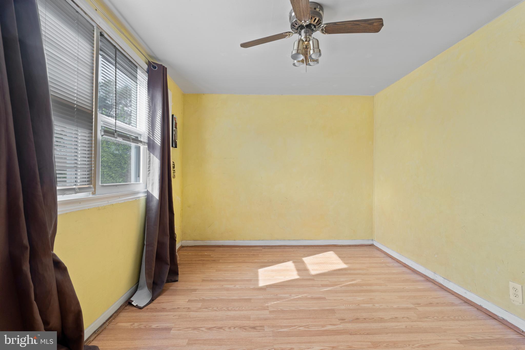 3031 Freeway Halethorpe, MD 21227 - Photo 11 of 25 a view of empty room with wooden floor and fan