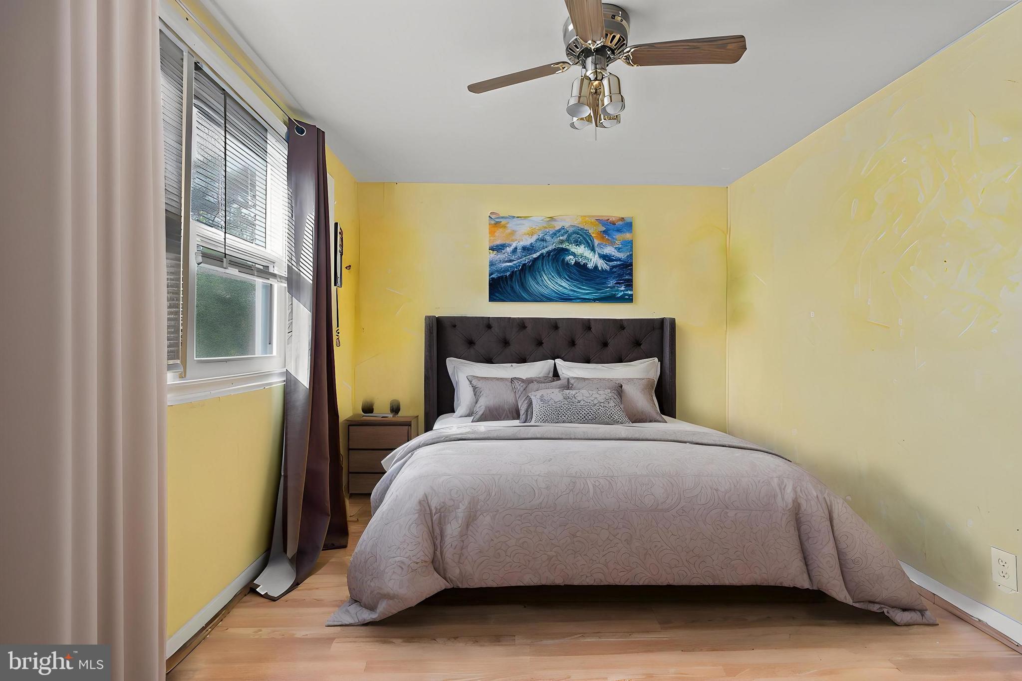 3031 Freeway Halethorpe, MD 21227 - Photo 13 of 25 a large bed sitting in a bedroom next to a window