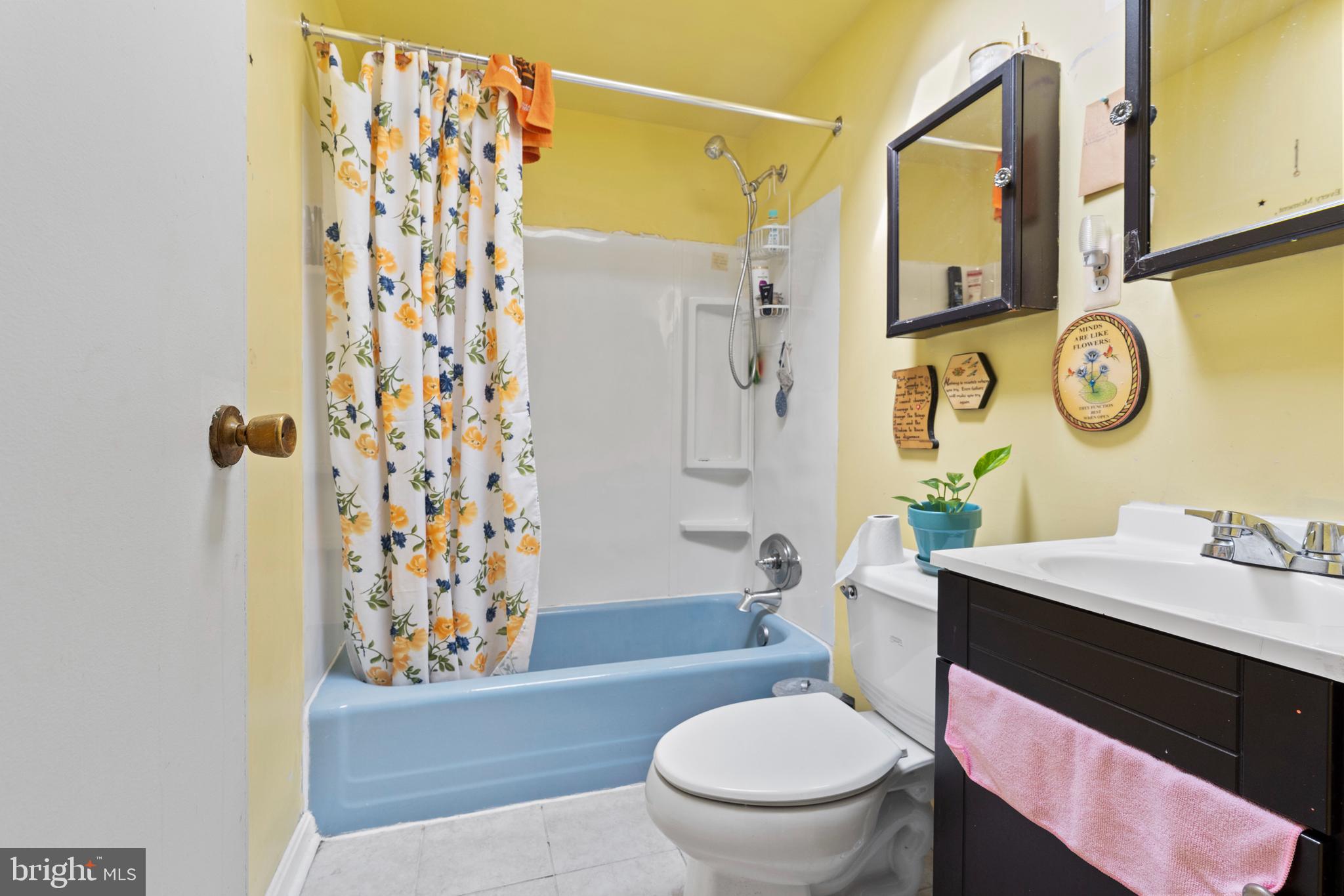 3031 Freeway Halethorpe, MD 21227 - Photo 14 of 25 a bathroom with a sink toilet and shower