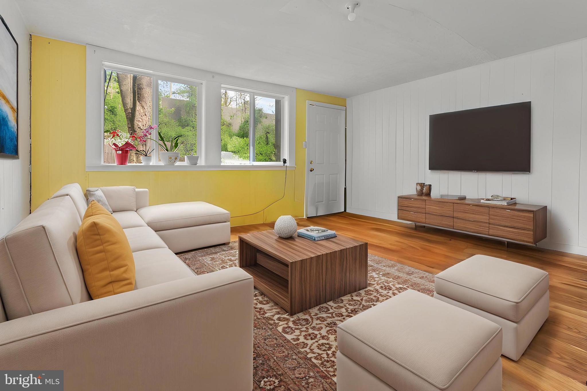 3031 Freeway Halethorpe, MD 21227 - Photo 9 of 25 a living room with furniture and a flat screen tv