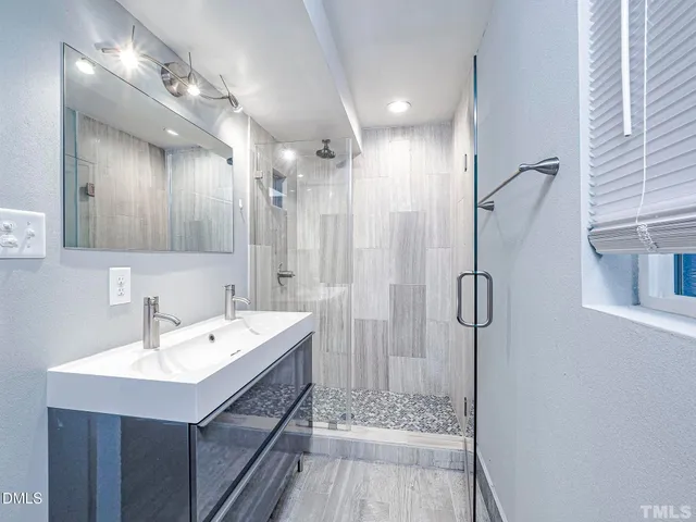 a view of hallway with stairs and wooden floor