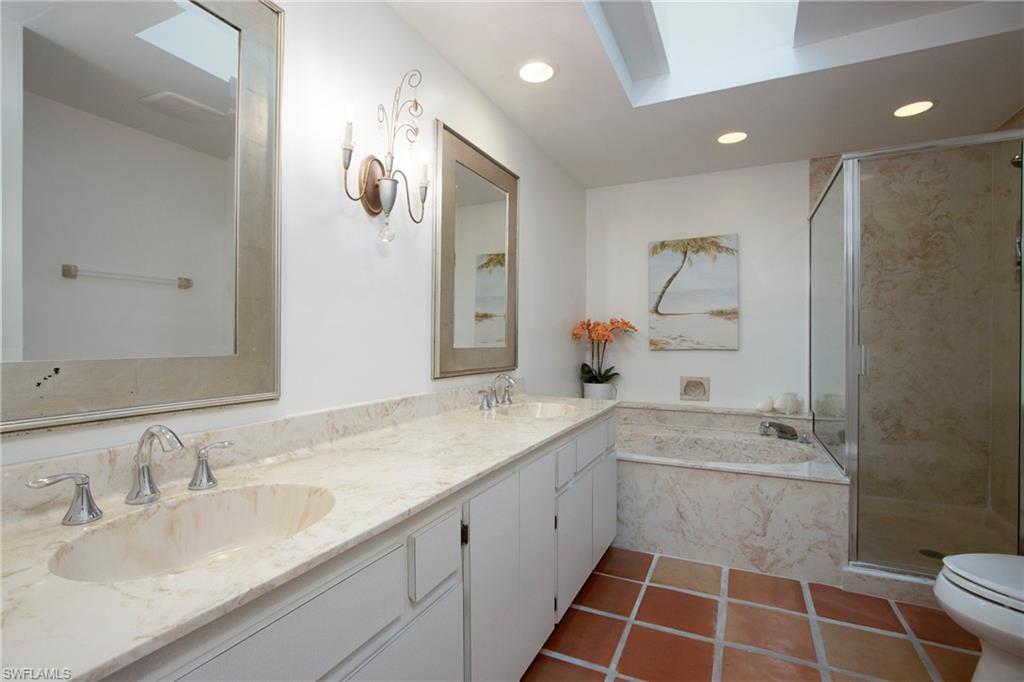359 2nd Avenue North Naples, FL 34102 - Photo 15 of 41 a bathroom with a sink double vanity and a mirror