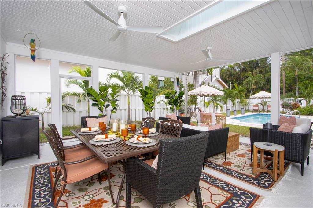 359 2nd Avenue North Naples, FL 34102 - Photo 25 of 41 a view of a dining room with furniture window and outside view