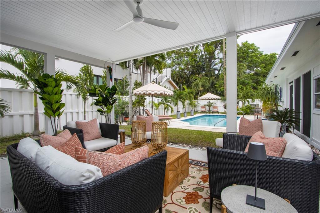 359 2nd Avenue North Naples, FL 34102 - Photo 27 of 41 a living room with patio furniture and a potted plant