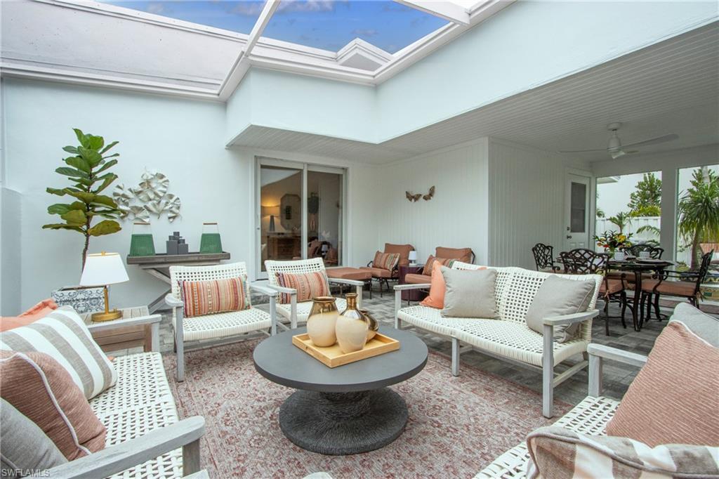 359 2nd Avenue North Naples, FL 34102 - Photo 30 of 41 a living room with furniture and a rug