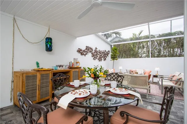 a outdoor dining space with furniture and outdoor view