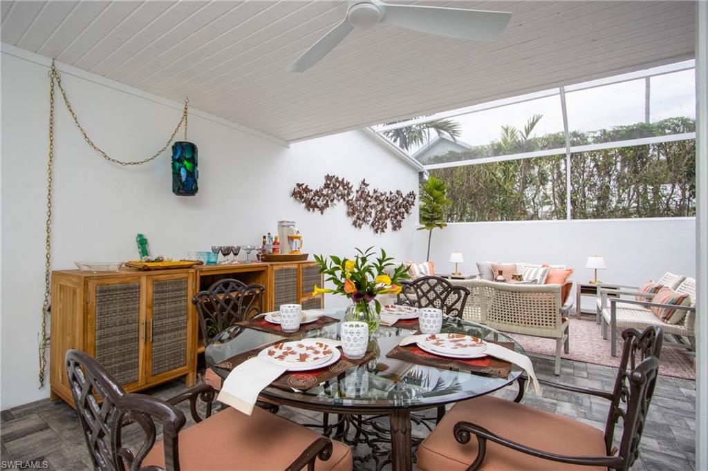 359 2nd Avenue North Naples, FL 34102 - Photo 34 of 41 a outdoor dining space with furniture and outdoor view