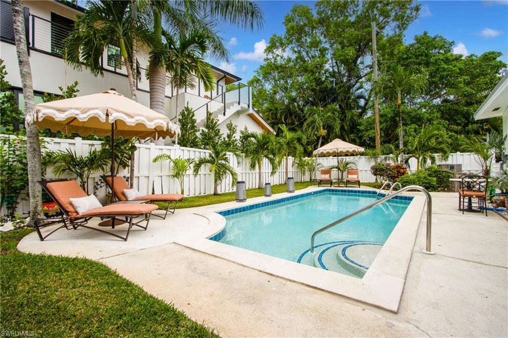 359 2nd Avenue North Naples, FL 34102 - Photo 37 of 41 swimming pool with outdoor seating and yard