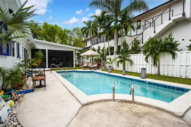 a view of swimming pool with chairs