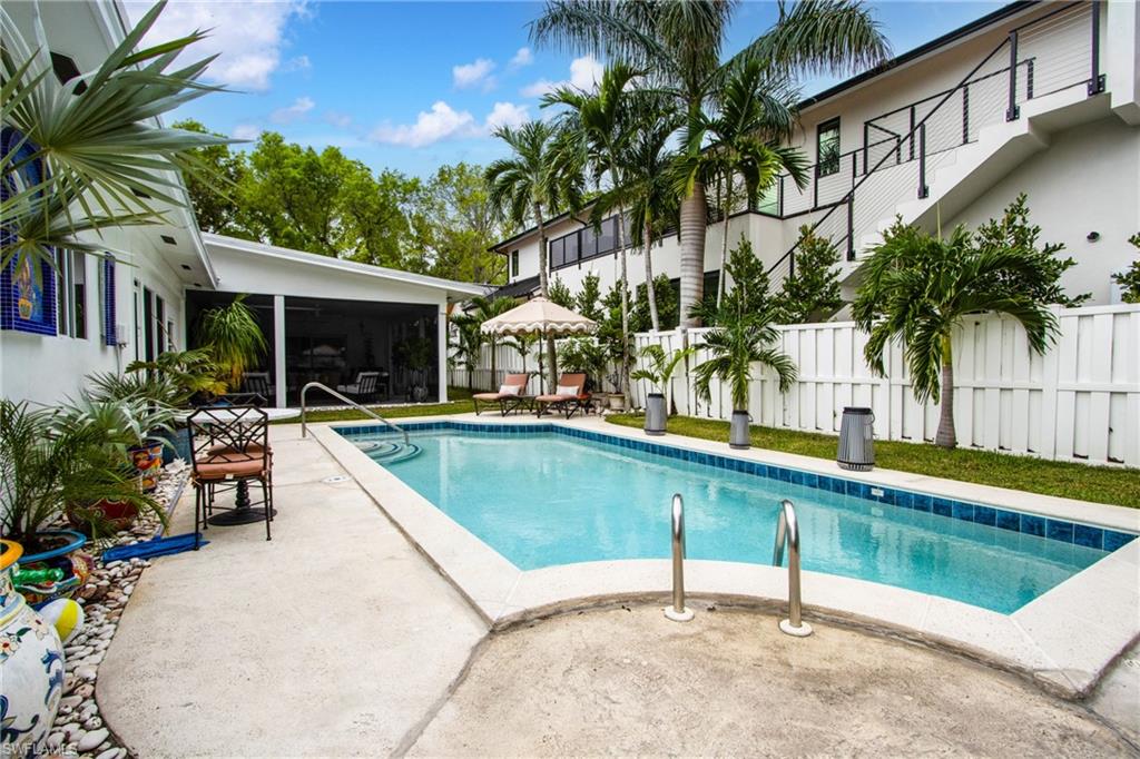 359 2nd Avenue North Naples, FL 34102 - Photo 38 of 41 a view of swimming pool with chairs