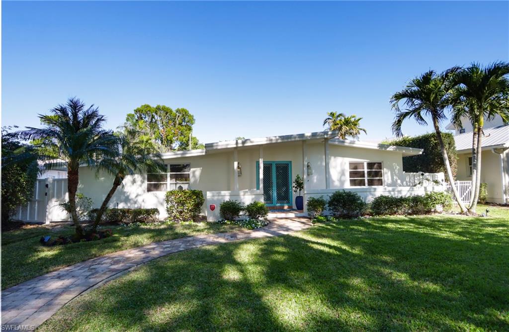 359 2nd Avenue North Naples, FL 34102 - Photo 41 of 41 a front view of a house with a garden and yard