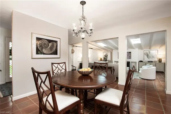 a dining room with furniture and window