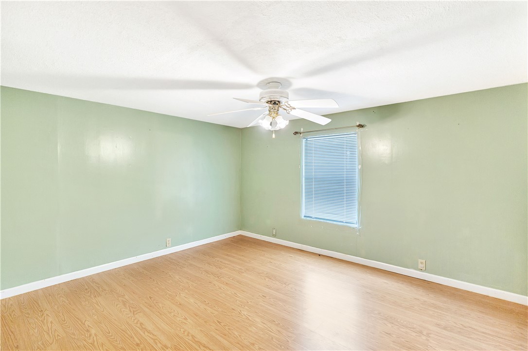 1004 Wiles Road Anderson, SC 29625 - Photo 17 of 26 A quiet bedroom with a ceiling fan, ready for personal touches.