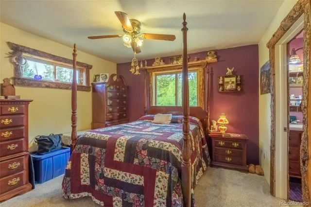 a bathroom with a sink a toilet and shower curtain