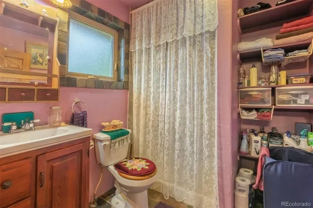 a bedroom with a bed dresser and a window