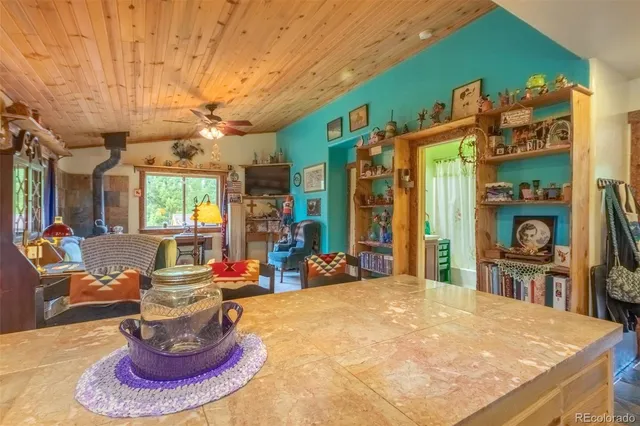 a room with furniture and a book shelf