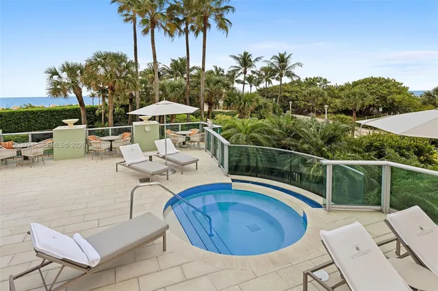 a view of a swimming pool with a patio