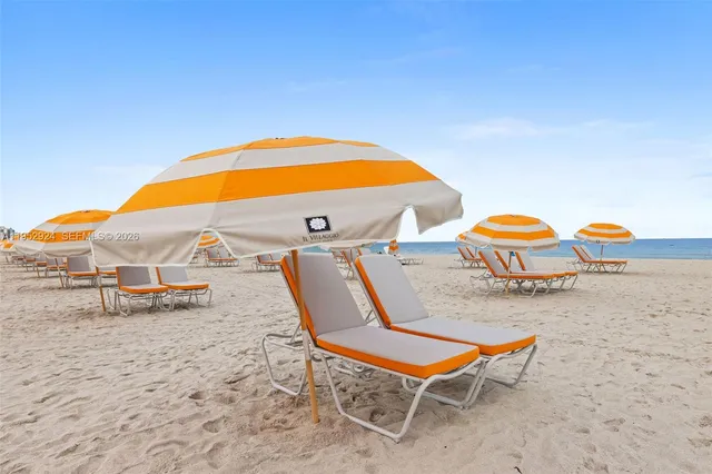 an outdoor space with pool and furniture