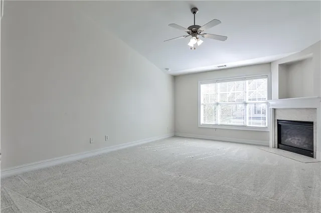 a bed room with a bed mirror and a window